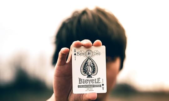Young man holding an ace in a presentation