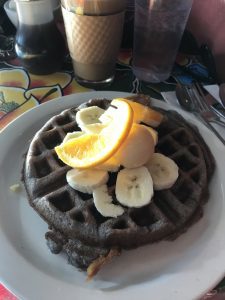 Belgian waffle, plate sized, distinctive violet gray color from blue cornmeal
