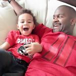 real men: father and son dressed in Falcon jerseys
