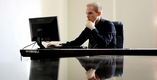 Lonely man sitting at desk at work
