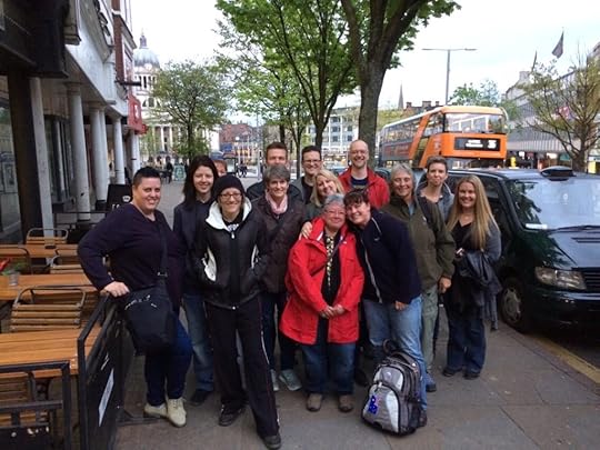 Photo of a group of writers standing on a street in Nottingham, England and smiling.