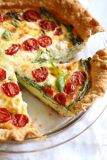 This vegetarian quiche recipe is made with spinach, ricotta cheese, eggs, tomatoes and basil. Perfect for breakfast, lunch or brunch or serve it with a salad for a light dinner.