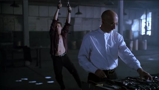 Marcus is standing in front of Angel.