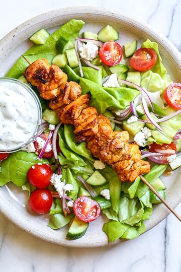 This Mediterranean inspired salad is made with Grilled Chicken Shawarma kebabs served over salad with Feta and Tzatziki.