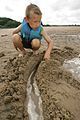 80px-Boy_playing_in_sand_on_beach