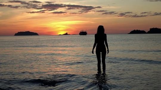 woman standing in the ocean