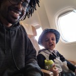 Two year old and dad on airplane