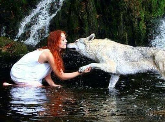 red haired woman with wolves