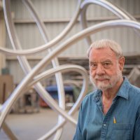 Bruce Beasley stands in f