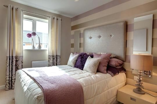 purple and white bedding horizontal rose gold stripes a tufted headboard provide focal point of this muted relaxing bedroom shades soft lavender neutrals gray