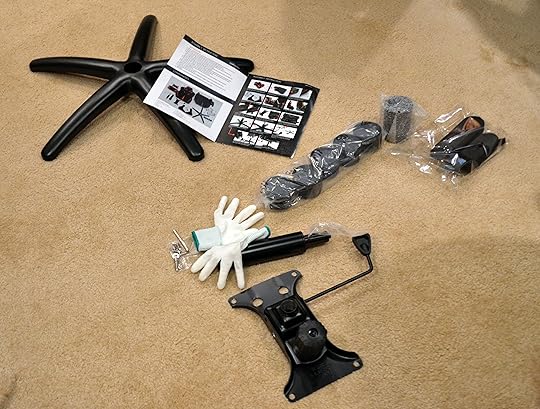 The smaller parts, gloves, and assembly instructions.