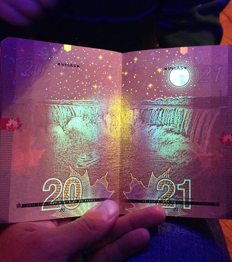 Canadian passport with UV light
