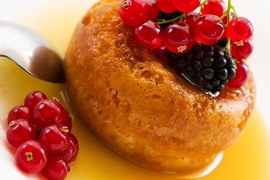 Baba of Naples with rum syrup with fresh backberry and currant