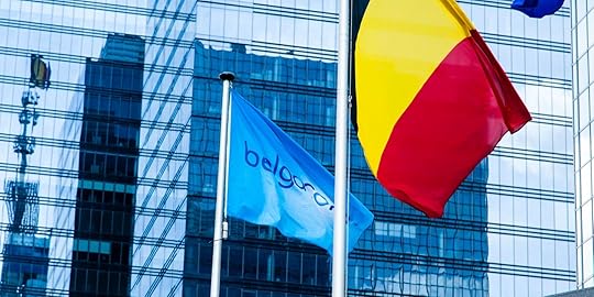 The Belgacom Group is the largest telecommunications company in Belgium, headquartered in Brussels.Belgacom flag, Belgian national flag hang together at the entrance mirrored in the windows. (Photo by Sander de Wilde/Corbis via Getty Images)
