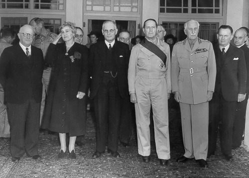 US Ambassador Nelson Johnson, Lady Gowrie, Australian Prime Minister John Curtin, Gen. Douglas MacArthur, Governor General Lord Gowrie, and Frank Forde, Australia, 8 Jun 1943 (public domain via WW2 Database)