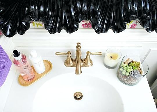delta champagne bronze powder room with damson peacock wallpaper black pink gold and purple bar faucet