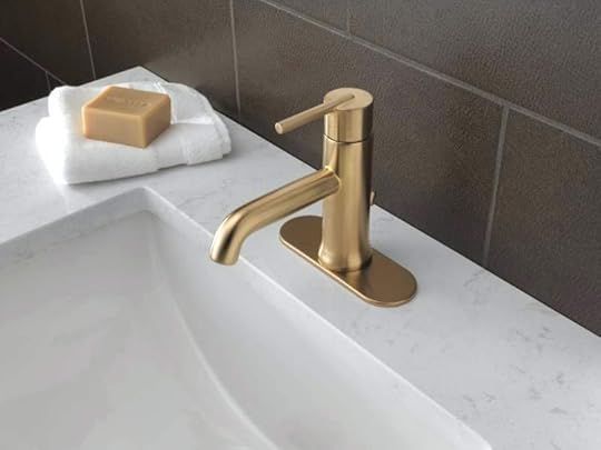 delta champagne bronze single hole bathroom faucet with metal pop up drain assembly limited lifetime warranty trinsic canada
