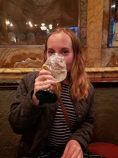 Image may contain: 1 person, sitting and drink