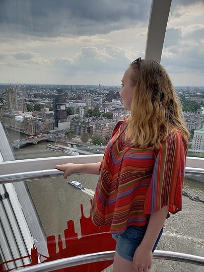 Image may contain: one or more people, people standing, sky, cloud, stripes and outdoor