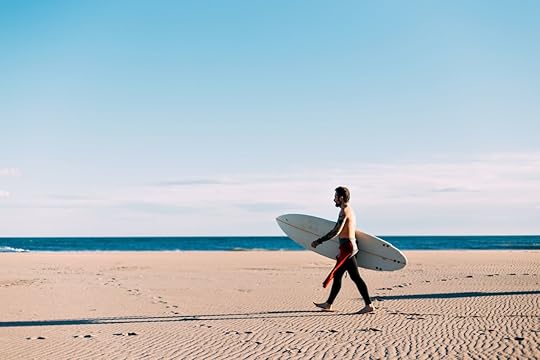 Open-and-empty-beach-with-lonely-surfer
