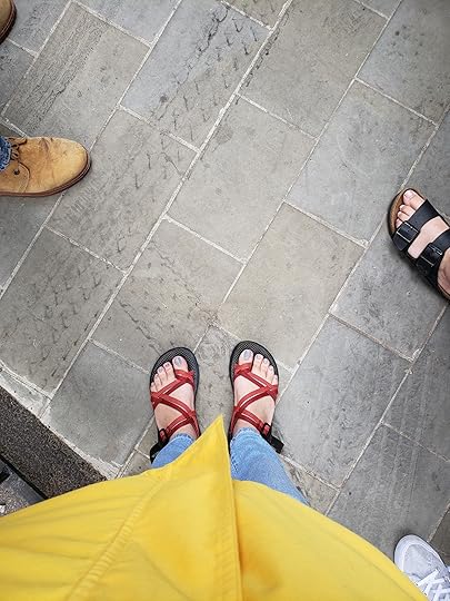 Image may contain: one or more people, shoes and outdoor