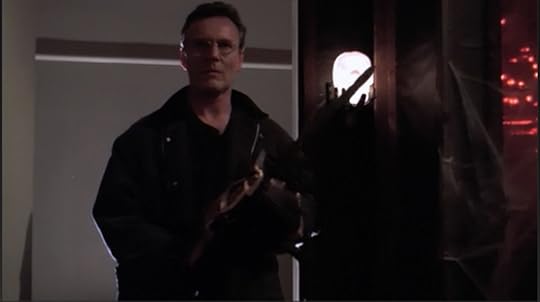Giles, still wielding his chainsaw and looking super scary serious.