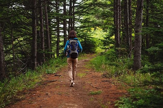 woman walking in woods
