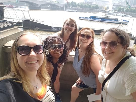 Image may contain: 4 people, including Susan Arnold, people smiling, people standing, sky, outdoor and water