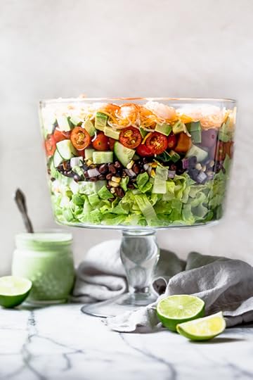 Mexican Shrimp Cobb Salad is a beautifully layered salad with shrimp, avocados, grilled corn, black bean salsa, cucumbers, tomatoes and cheese. 