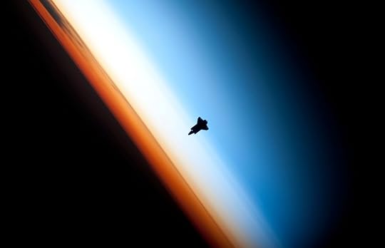 Earth's stratosphere (the white band) with space shuttle Endeavour silhouetted (NASA)
