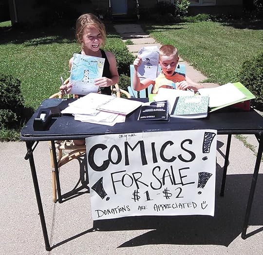 Comics for sale: Two kids and their comic book stand.