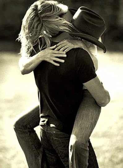 woman kissing a cowboy