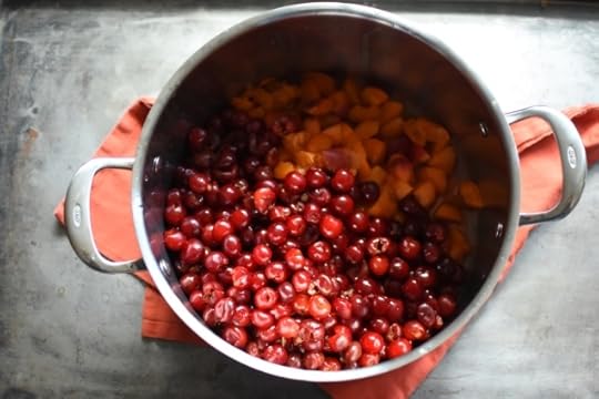 sour cherries and apricots in a pot