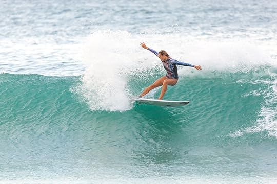 Woman surfing banzai pipeline in Oahu, Hawaii