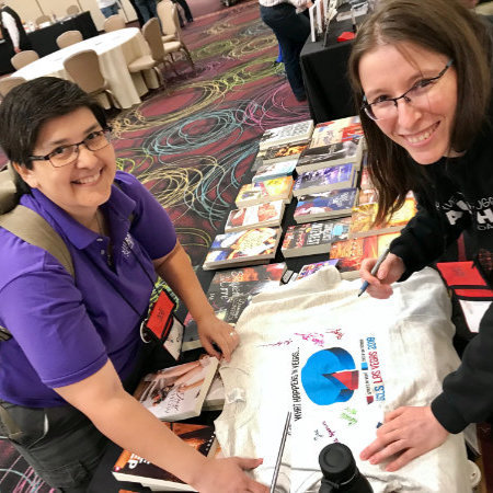 Signing a shirt for a reader