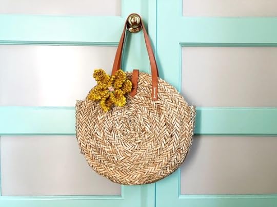 How to Knit a Flower by Vickie Howell | In this video and written tutorial, show how to #knit a flower embellishment. #howtoknit #knitting #knittingpattern #knitflower #vickiehowell #askmemonday #yarnflower