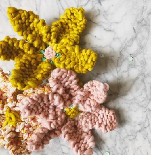 How to Knit a Flower by Vickie Howell | In this video and written tutorial, show how to #knit a flower embellishment. #howtoknit #knitting #knittingpattern #knitflower #vickiehowell #askmemonday #yarnflower