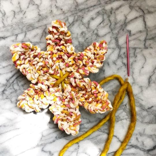How to Knit a Flower by Vickie Howell | In this video and written tutorial, show how to #knit a flower embellishment. #howtoknit #knitting #knittingpattern #knitflower #vickiehowell #askmemonday #yarnflower #boho #bohemianflower