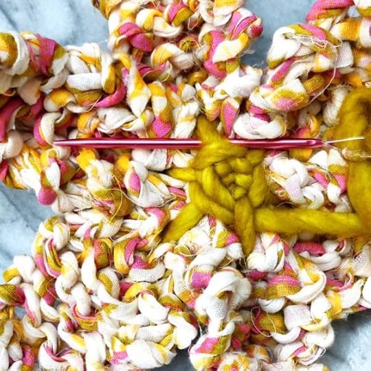 How to Knit a Flower by Vickie Howell | In this video and written tutorial, show how to #knit a flower embellishment. #howtoknit #knitting #knittingpattern #knitflower #vickiehowell #askmemonday #yarnflower