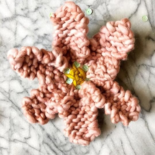 How to Knit a Flower by Vickie Howell | In this video and written tutorial, show how to #knit a flower embellishment. #howtoknit #knitting #knittingpattern #knitflower #vickiehowell #askmemonday #yarnflower