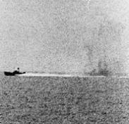 Photograph taken from USS Maddox (DD-731) during her engagement with three North Vietnamese motor torpedo boats in the Gulf of Tonkin, 2 August 1964. (Courtesy of the U.S. Naval Historical Cente)r