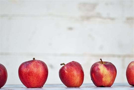 Imperfect apple next to perfect apples.