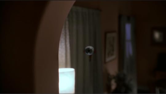 Ronald's actual, physical eye is floating the air in Melissa's bedroom.