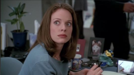 Melissa's eyes are super wide in horror.