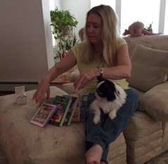 Rex looks on as Chelle sets up a Pepe Prize display