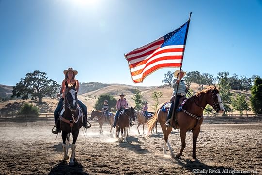 drill team riders on horseback with American Flag at the Alisal Ranch 