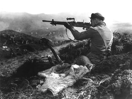 Canadian soldier inspecting a captured Japanese machine gun, Kiska, Aleutian Islands, 16 Aug 1943 (Source: US Library of Congress)