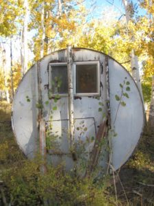 image of a fallout shelter in the woods