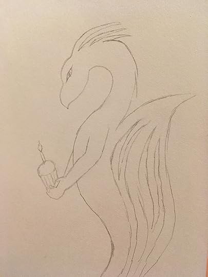 Dragon holding a cupcake
