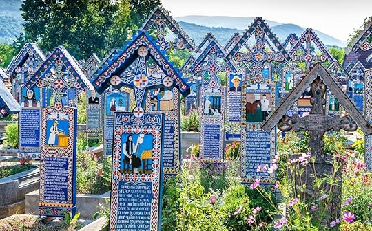 Painted wooden crosses in the famous Merry Cemetery in Maramures